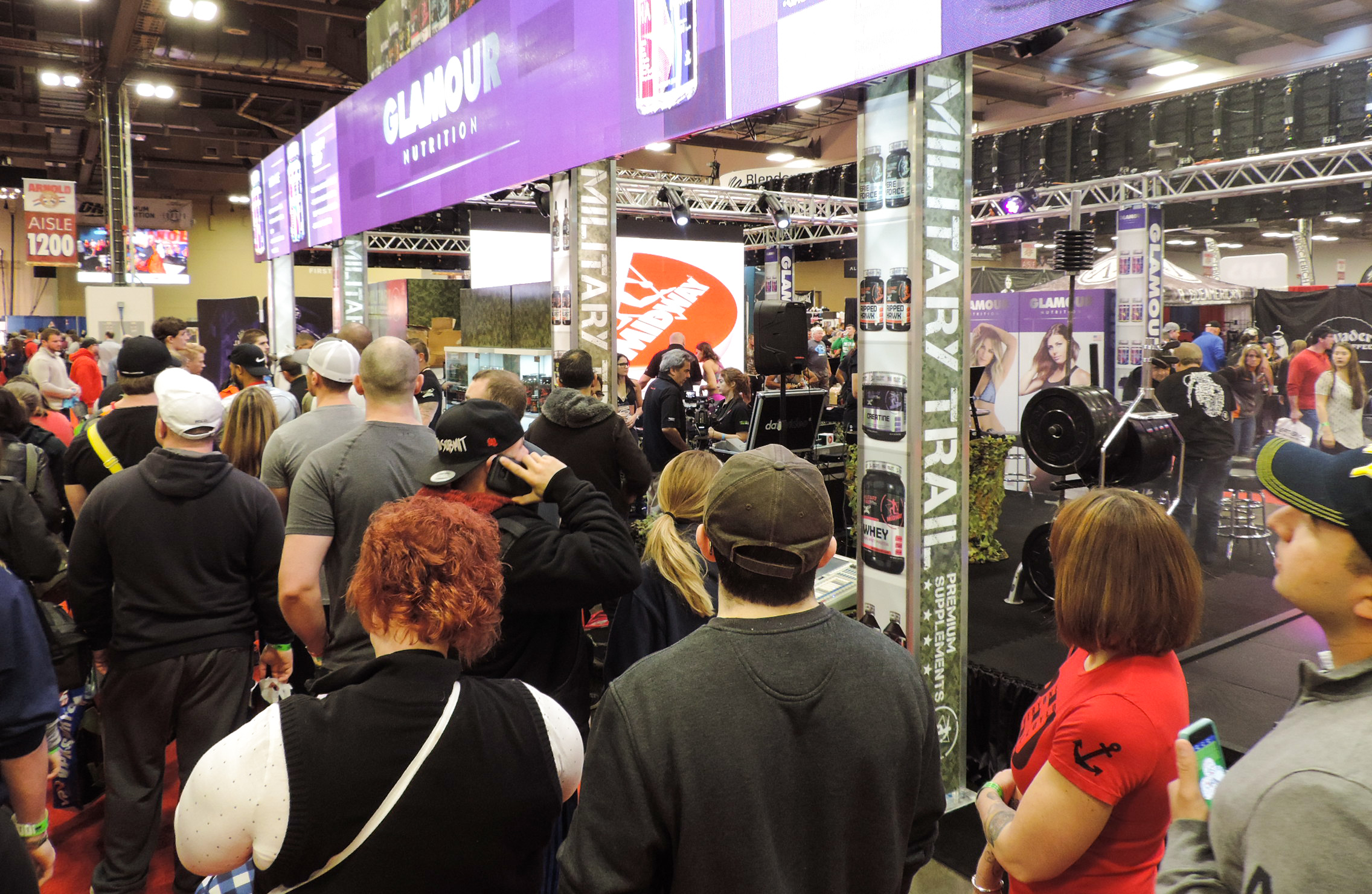 People checking out the Glamour Nutrition & Military Trail booth.